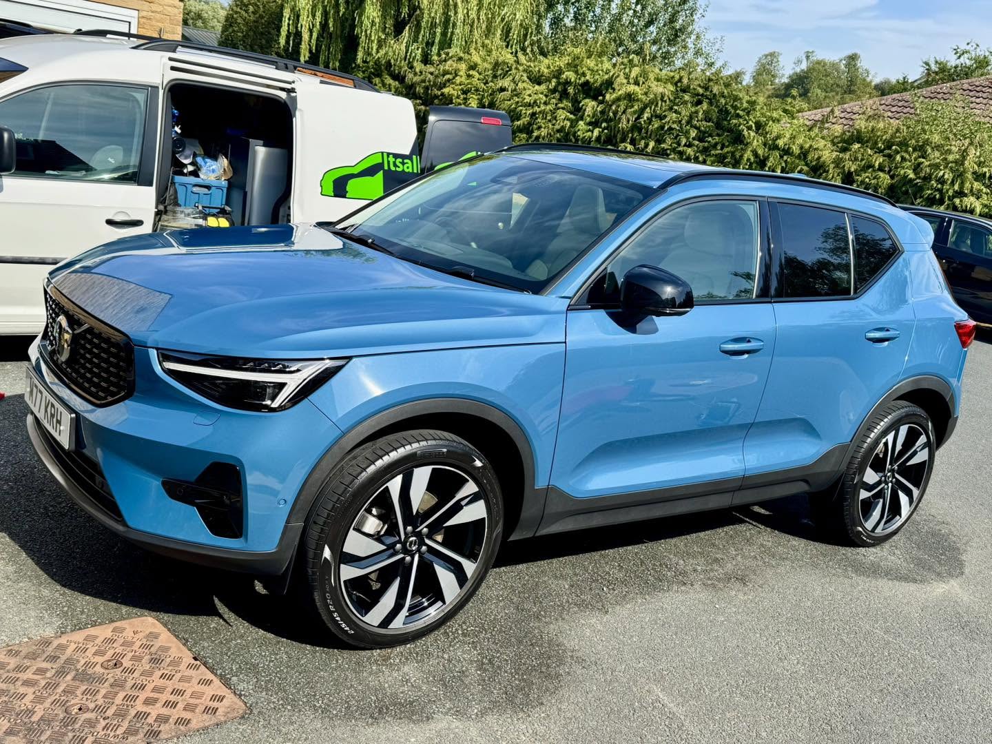 Blue Volvo XC40 beside the Itsallinthedtail van after a full valet